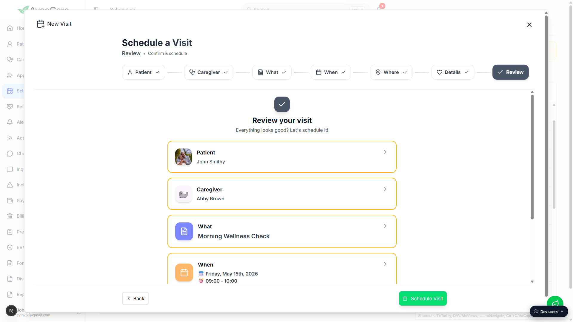 Review step of the Schedule a Visit wizard showing the Patient John Smithy, Caregiver Abby Brown, What Morning Wellness Check, and When Friday May 15th 2026 09:00 to 10:00 summary cards above a green Schedule Visit button