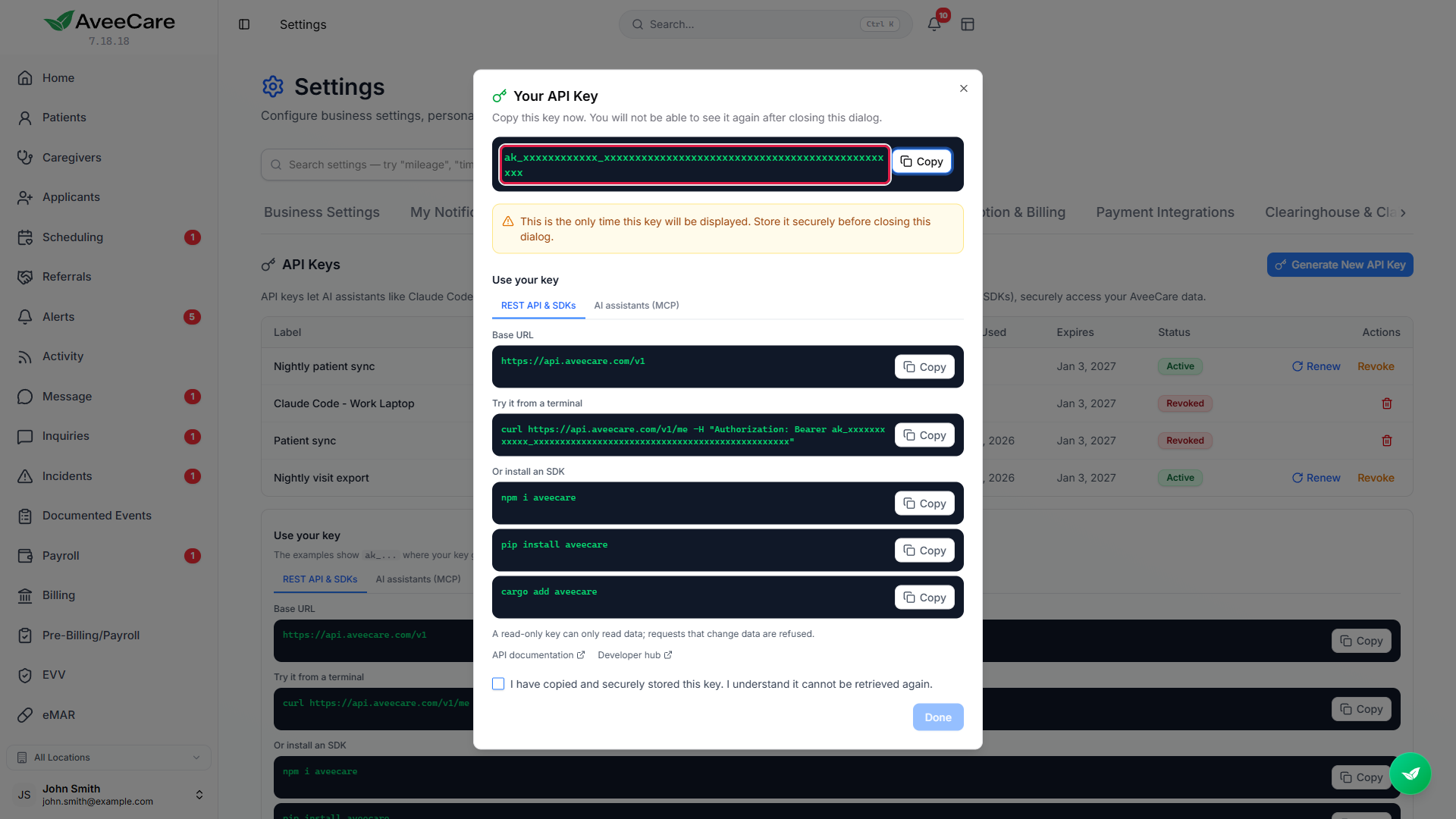 Your API Key dialog with the key, masked in this picture, outlined in a red box, the once-only warning, and the Use your key panel with REST API and SDKs examples that include the new key.