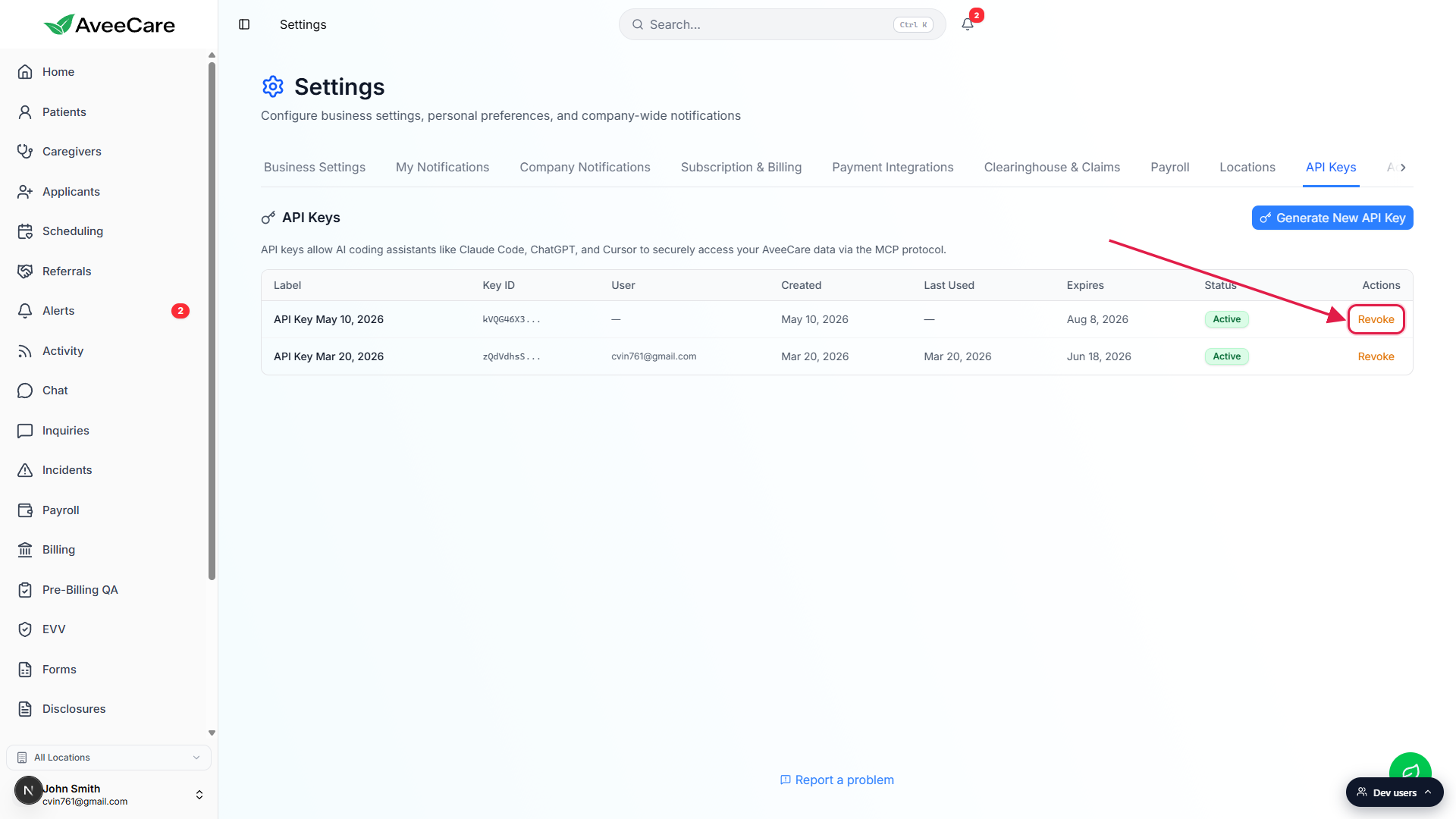 API Keys list with two Active rows. The Revoke link in the Actions column on the top row is outlined in a red box with an arrow pointing to it.