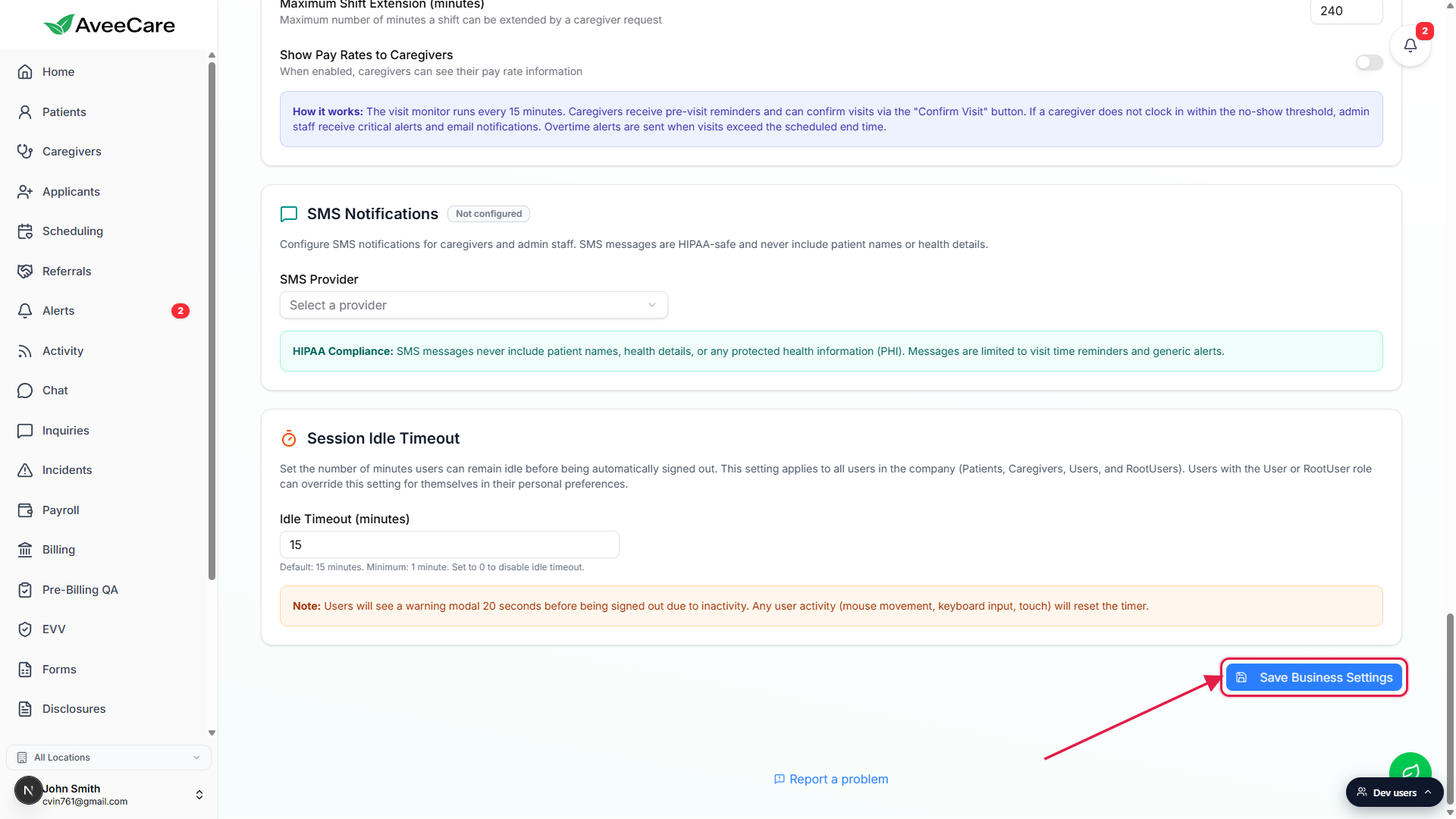 Bottom of the Business Settings tab with the Save Business Settings button on the right highlighted with a red box and arrow. Visit Monitoring, SMS Notifications, and Session Idle Timeout cards are visible above the button.