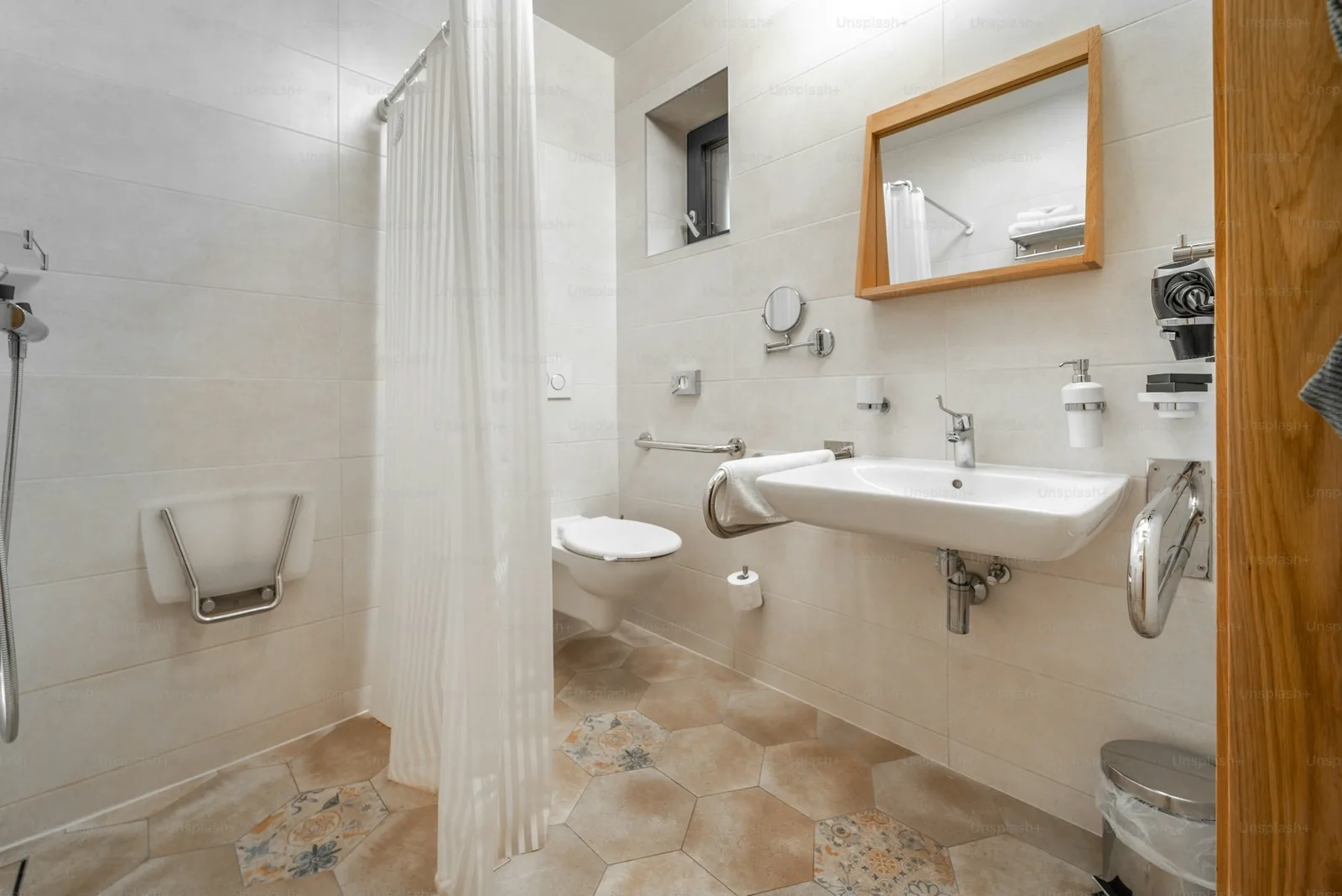 An accessible bathroom interior with grab bars and roll-in shower, suitable for stroke recovery at home