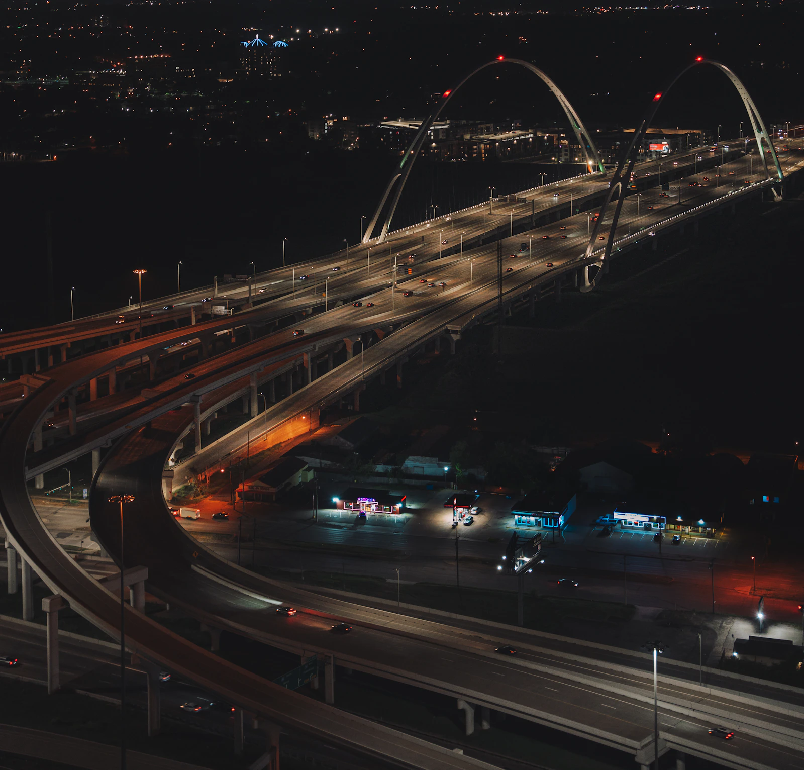 Aerial view of a Texas freeway at night, illustrating the scale of Texas home care operations