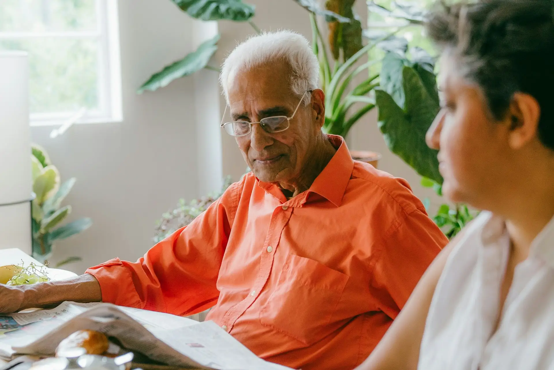 Elderly couple talking together representing the importance of communication in Parkinson's home care